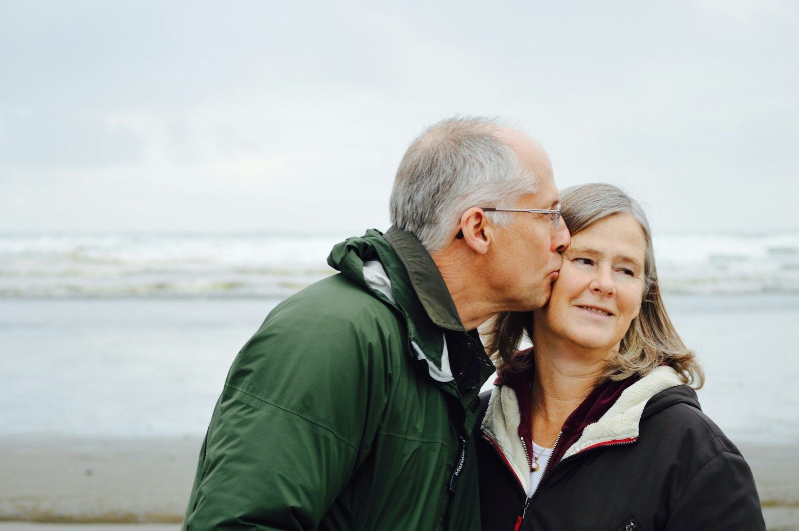 Older couple sharing a happy moment at the beach