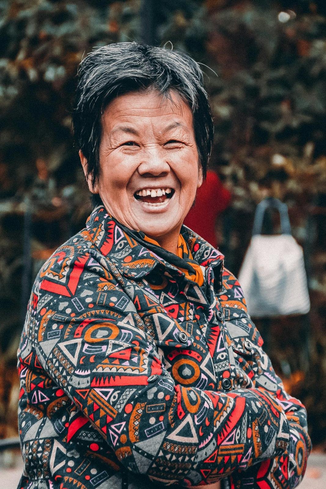 Laughing older woman outdoors