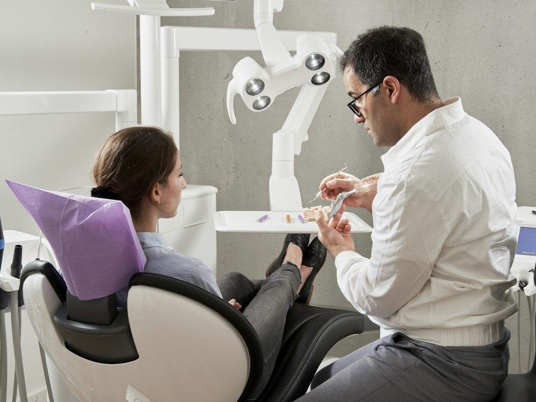 Dentist talking with a patient during a consultation