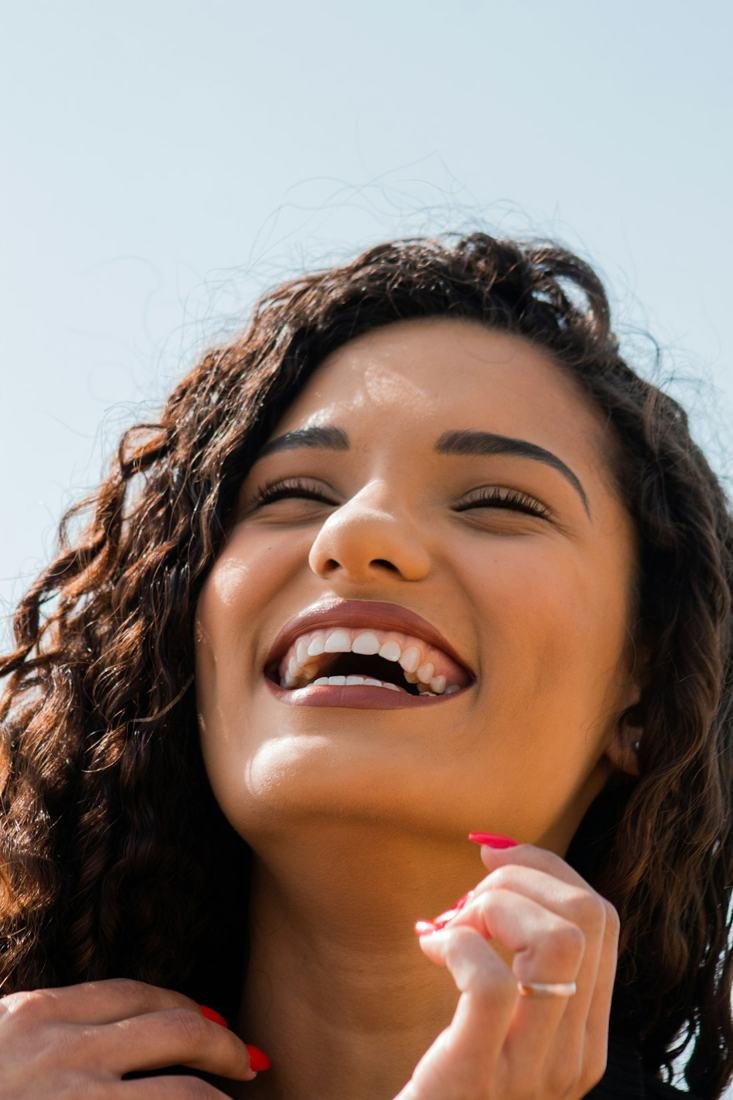 Woman laughing with a bright smile